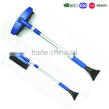 extendable rotating snow cleaning brush with scraper