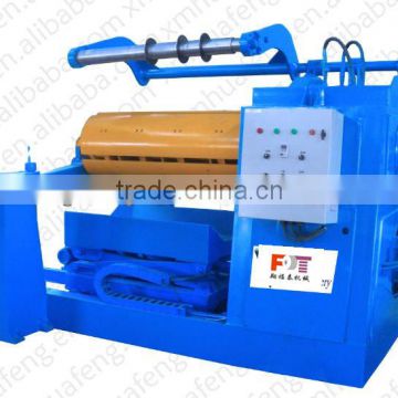coil slitter rewinder with hold down arms
