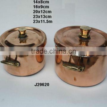 Copper saucepan with pewter lining and brass handles polished