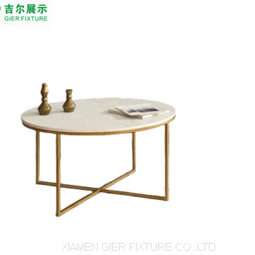 Gold metal X-base round marble top coffee tables