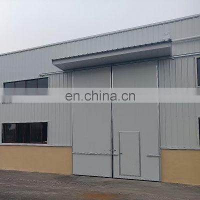 Qingdao prefabricated curved steel fabrication insulated auto workshop layout building