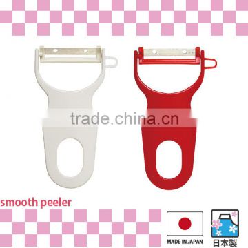 High quality rust-resistant peeler white and red colored kitchen utensils