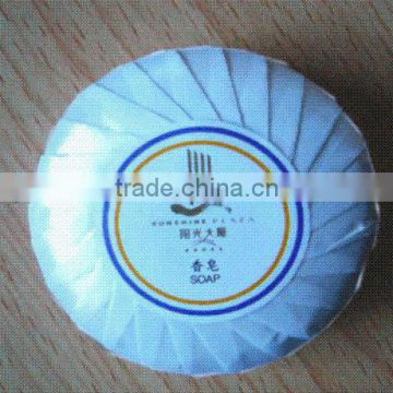 Hotel round soap with blue pleated wrapper