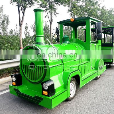 Amusement park locomotives customized green steam ride on trackless train for sale