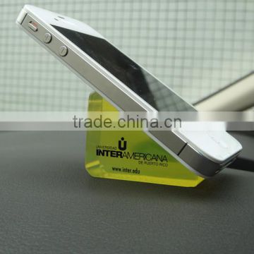 Universal dashboard cell phone holder