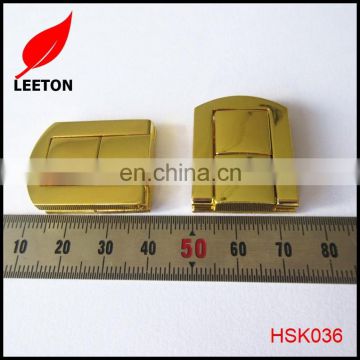 Shiny gold metal lock for wooden box