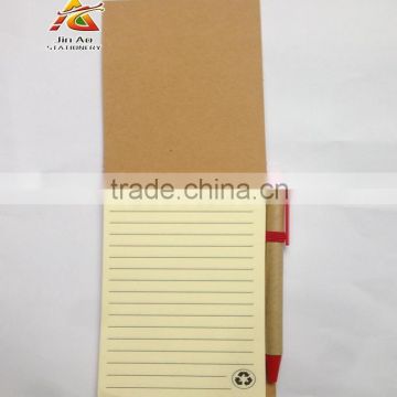 craft paper notebook with pen