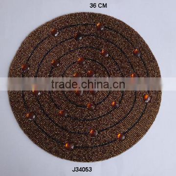 Round brown Glass bead place mat with black circles patterns available in more colours and patterns