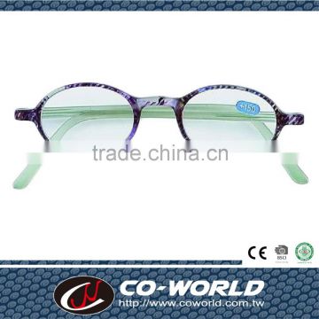 Reading glasses, purple oval frame, green earstems