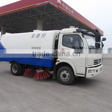Road cleaning truck with cleaning brushes and water spraying function
