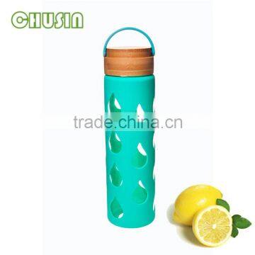 fashionable glass water bottle with handle and silicone sleeve and straw wholesale