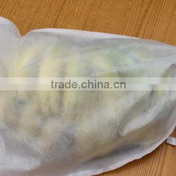 Grapes and banana are packaged by nonwoven fabric with high quality