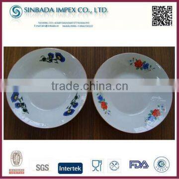 Porcelain soup plate with yellow rim and designs