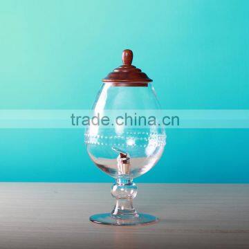 glass jar dispenser with stemmed and wooden cover