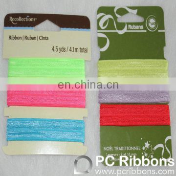 Fold over elastic retail packing ribbon