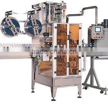 sleeve labeling machine with label shrinking tunnel and steam generator