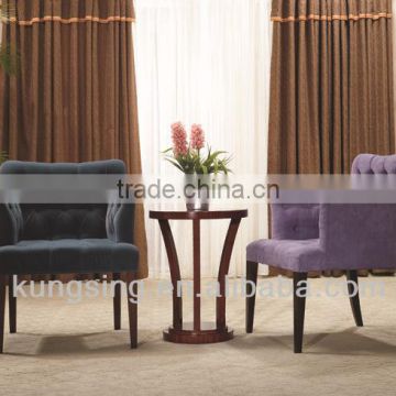 coffee table with fabric chairs