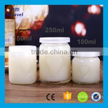 Clear round embossed heart shape glass pudding bottle with plastic cap