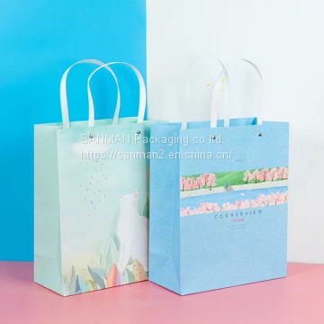 Light blue small gift paper bag with handle
