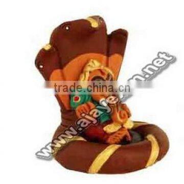 Ganesha on Snake Statue in Color