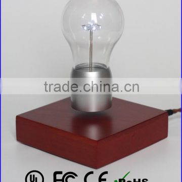 Wood base magnetic levitation floating illuminated bulb