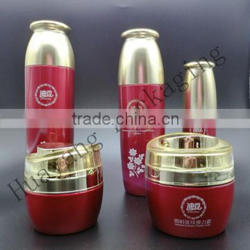 red glass bottle with golden plastic cap a family cosmetic glass bottle