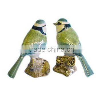 hand painted ceramic blue tit on stone for garden decoration