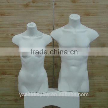 Displaying fiberglass half body male and female mannequin torso