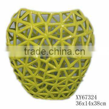 Ceramic green vase with holes