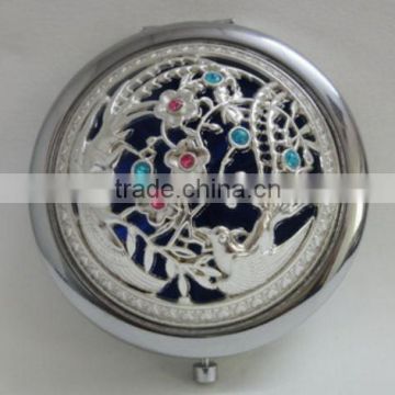 silver hollowed-out cosmetic mirror
