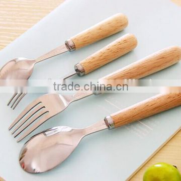 2015 latest design of wooden handle stainless steel cutlery set                        
                                                Quality Choice