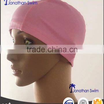 Women's solid color nylon spandex swim cap.