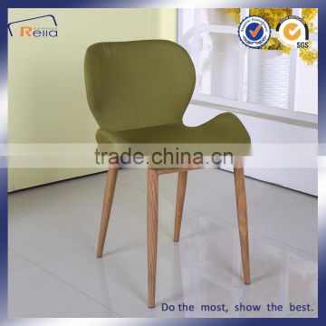 Upholstered dining chairs with wood color legs