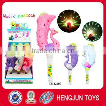 Promotional candy gift items special design toys with best prise peacock projection stage lamp 12 pcs