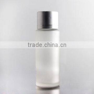 round glass lotion bottle with silver cap