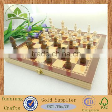 wood chess pieces with chess box