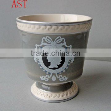 Stock ceramic flower pot in grey color round shape