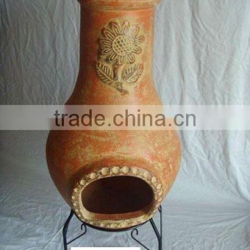 Clay chimney with metal stand, fire shelf and lid for garden decoration