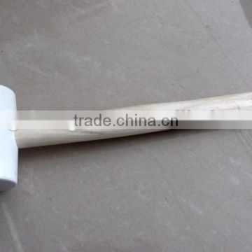 white colored rubber mallet hammer with wooden handle