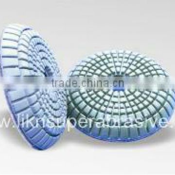 Convex wet polishing pads with QRS