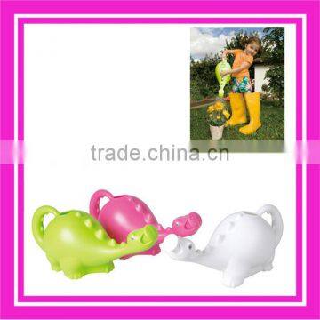 plastic watering can for kids using