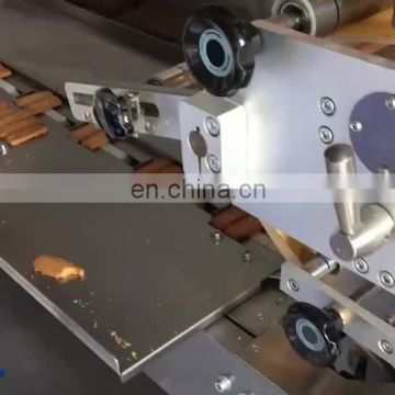 Horizontal pillow type packaging machine for egg roll