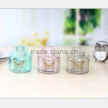 glass candle holder with butterfly and handle