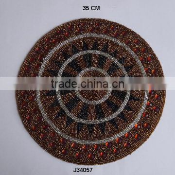 Round brown and amber Glass bead place mats with patterns available in more colours and patterns