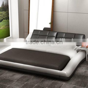 Wave shape leather bed with round coffee table