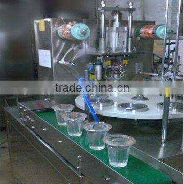 Water cup rotary filling and sealing machine