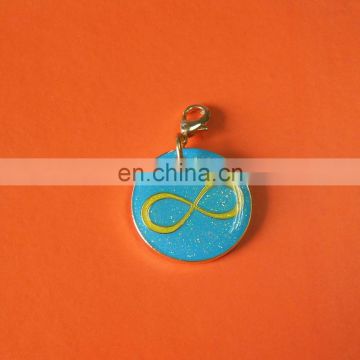 round shape metal tag charm with crystal and epoxy