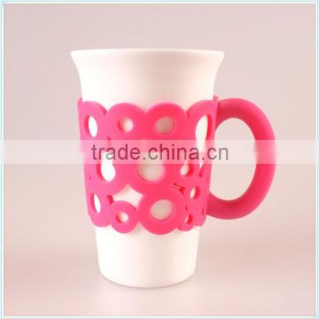 ceramic coffee mug with unique handle in silicone