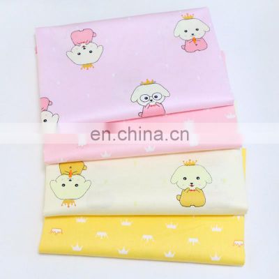 Kindergarten baby cloth cartoon dog crown printed cotton twill fabric environment-friendly printing and dyeing fabric