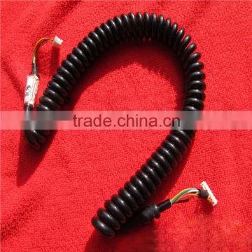 High flex coiled power cord with terminal at the end of the cable